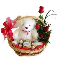 Basket of 12 red roses, teddy and 16 ferrero rocher chocolates