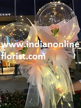2 Pink rose in 2 transparent balloon arrangement with fairy light White wrapping