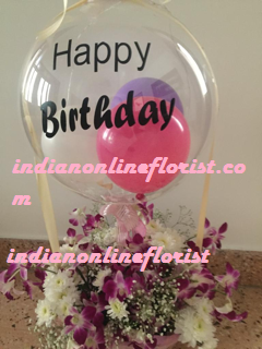 1 Clear transparent bubble bobo balloon with letter happy birthday Sticker stuffed with balloons and tied with ribbon to a basket of orchids and white flowers